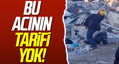 Yıkılan bina enkazında çocuklarının giysilerini koklayıp feryat etti